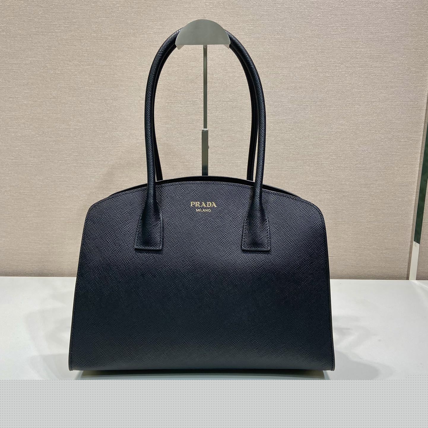 Pra*a top handle bags